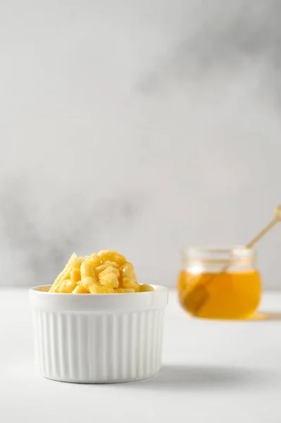 White ramekin with chak chak and honey in a jar on a white table. — Stock Photo, Image