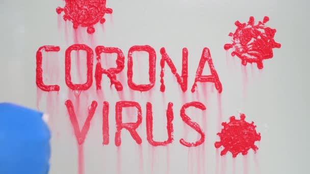 Stop coronavirus concept. hand in blue rubber glove washes glass from red paint — Stock Video