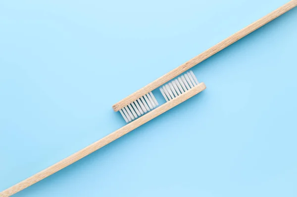 Zero waste concept. Two of eco friendly bamboo toothbrushes on a light blue background. — Stock Photo, Image