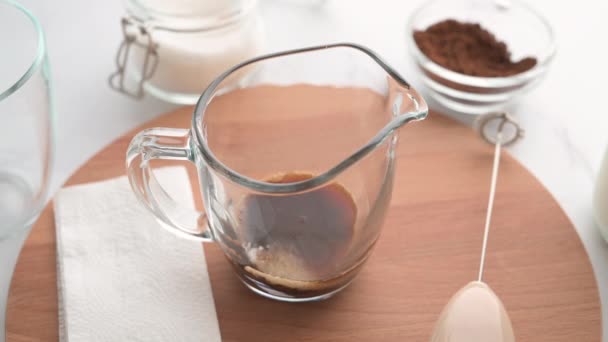 Korean refreshing creamy whipped coffee. The process of making Dalgona coffee. — Stock Video