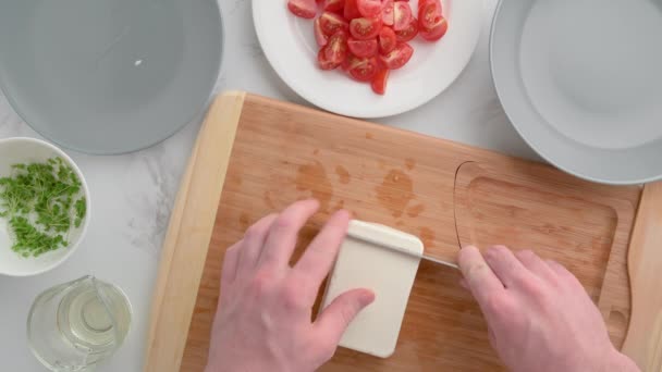 Chef cuts feta cheese. Vegan food. Summer refreshing salad. — Stock Video