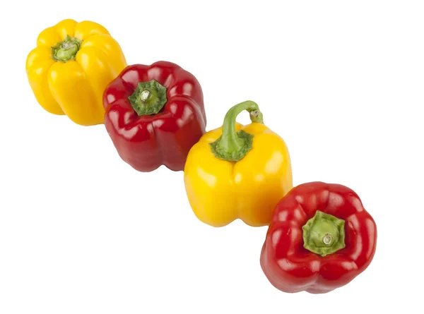 Red and yellow peppers on a white background — Stock Photo, Image