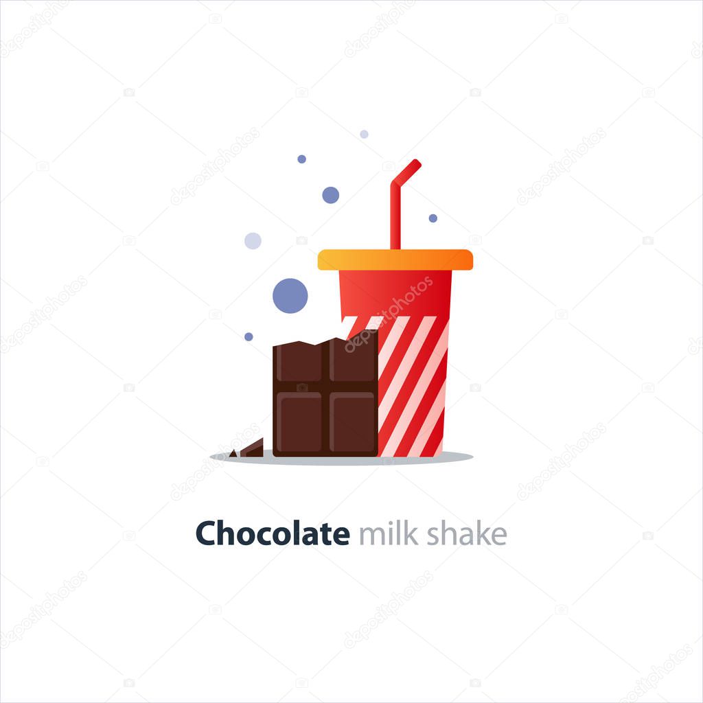 High glass of milk shake with chocolate bar, refreshing drink