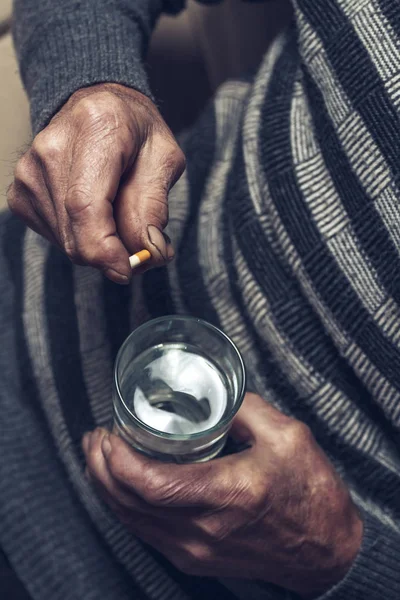 Many multi-colored pills in a Seniors hands — Stock Photo, Image