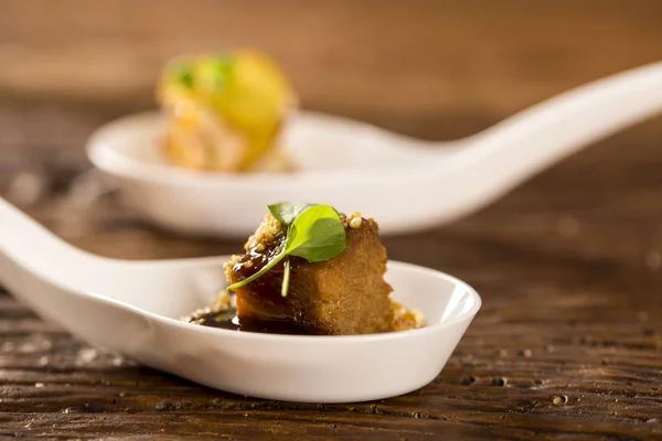 Pork tongue, ground banana, Marsala reduction, water meal and Mini watercress in a spoon. — Stock Photo, Image