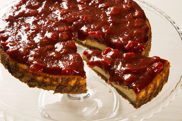 Cheesecake with brazilian goiabada jam of guava on plate on tabl — Stock Photo, Image