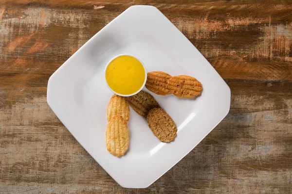 Chocolate chip cookie, peanut and guava with mango foam — Stock Photo, Image