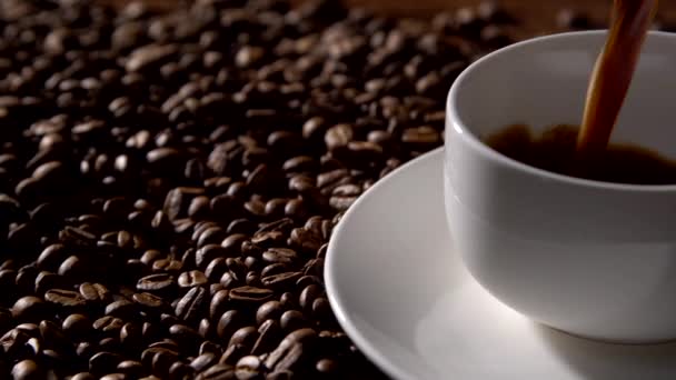 Pouring Coffee Coffee Pot White Cup Surrounded Coffee Beans — Stock Video