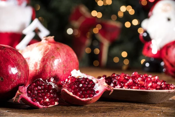 Ripe pomegranates on a wooden background. — Stock Photo, Image