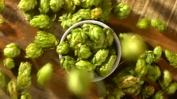 Hops Falling Red Heart Bowl Top View Slow Motion — Stock Video