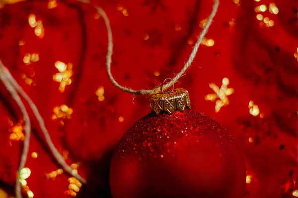 New year ball red background — Stock Photo, Image