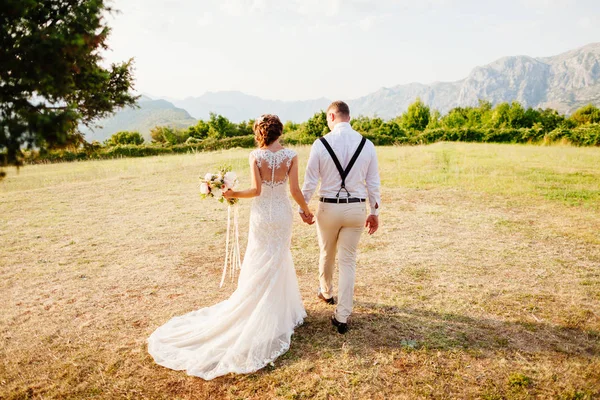 honeymoon wedding couple travel sea side back view