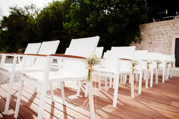 Wedding chairs with flowers decoration — Stock Photo, Image