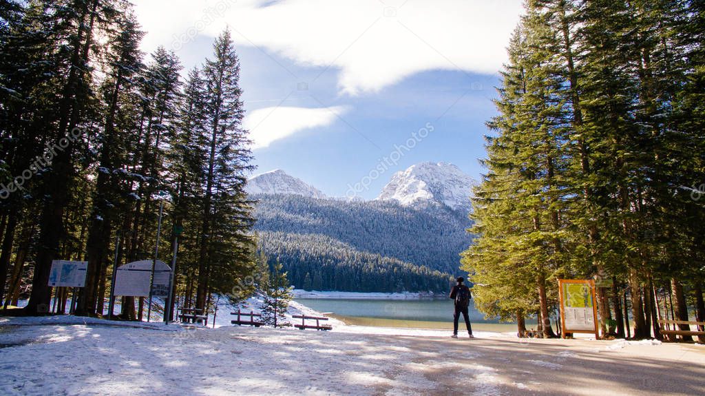 tourist man travel to snowy mountains 