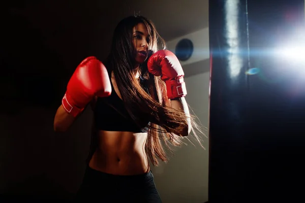 Sexy fighter girl punching actively — Stock Photo, Image