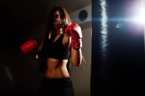 Sexy fighter girl punching actively — Stock Photo, Image