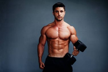 Handsome Muscular Bodybuilder Posing clipart