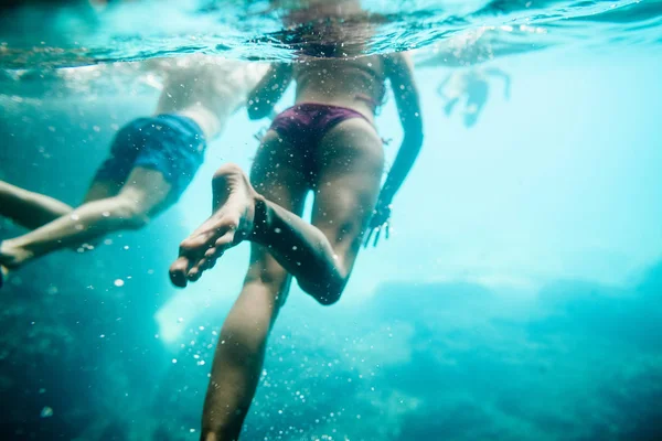 Group of people swim underwater — Stock Photo, Image