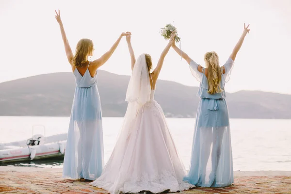 bridesmaids and bride on beach