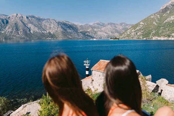 Two Girls Relaxing Seashore Mountains View Kotor Bay Montenegro Stock Image