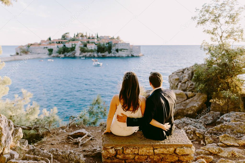 couple travel sea side with island view in Montenegro