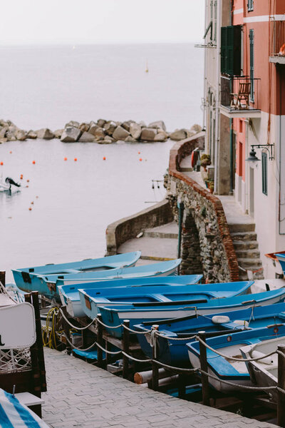 Wooden boats parking harbour in Cinque Terre, Riomaggiore. Travelling Italy