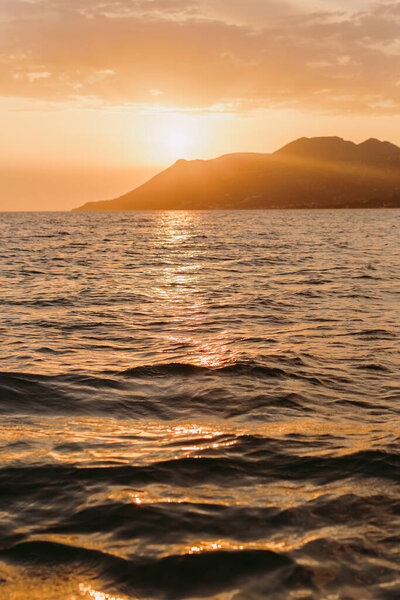 beautiful sea sunset with mountains view. Picturesque sea landscape. Romantic atmosphere