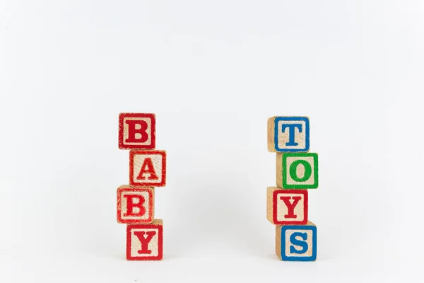De ordet leksak och Baby i trä Childrens block — Stockfoto