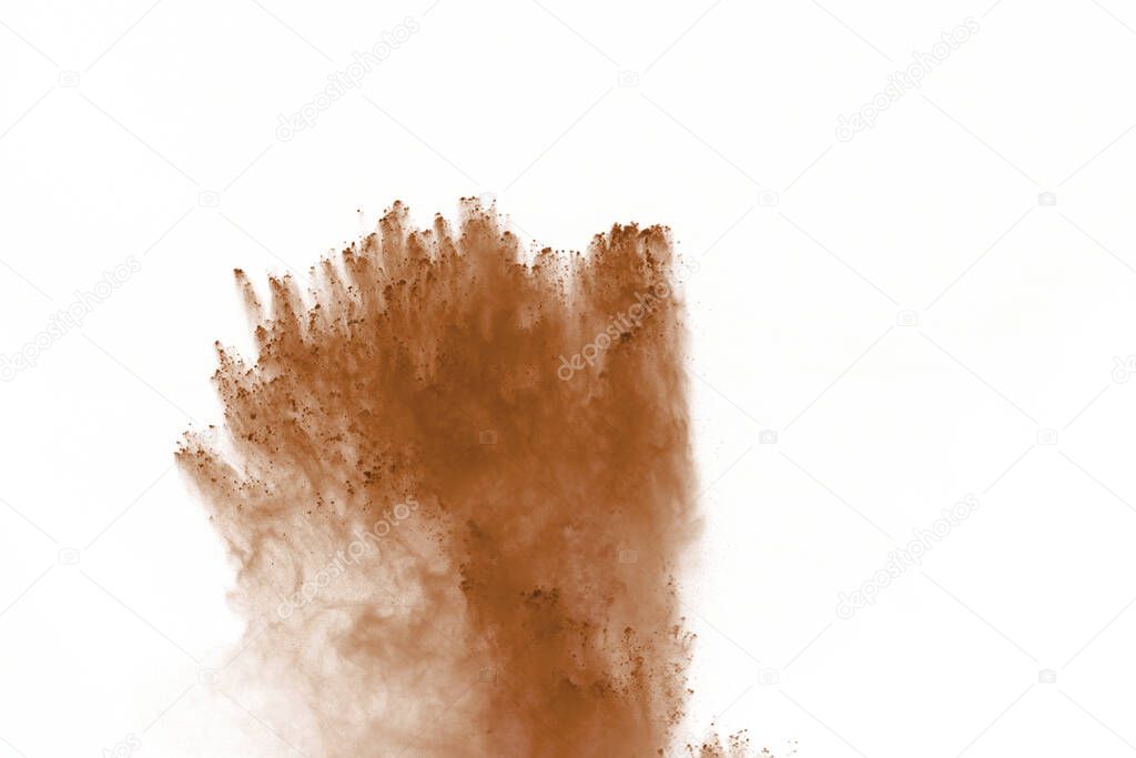 Coffee explosion isolated on white background.Explosion of brown powder, isolated on white background.