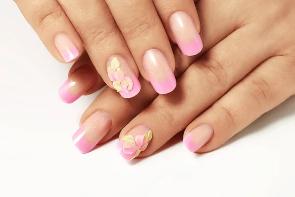 Pink nail polish on the nails of women. — Stock Photo, Image