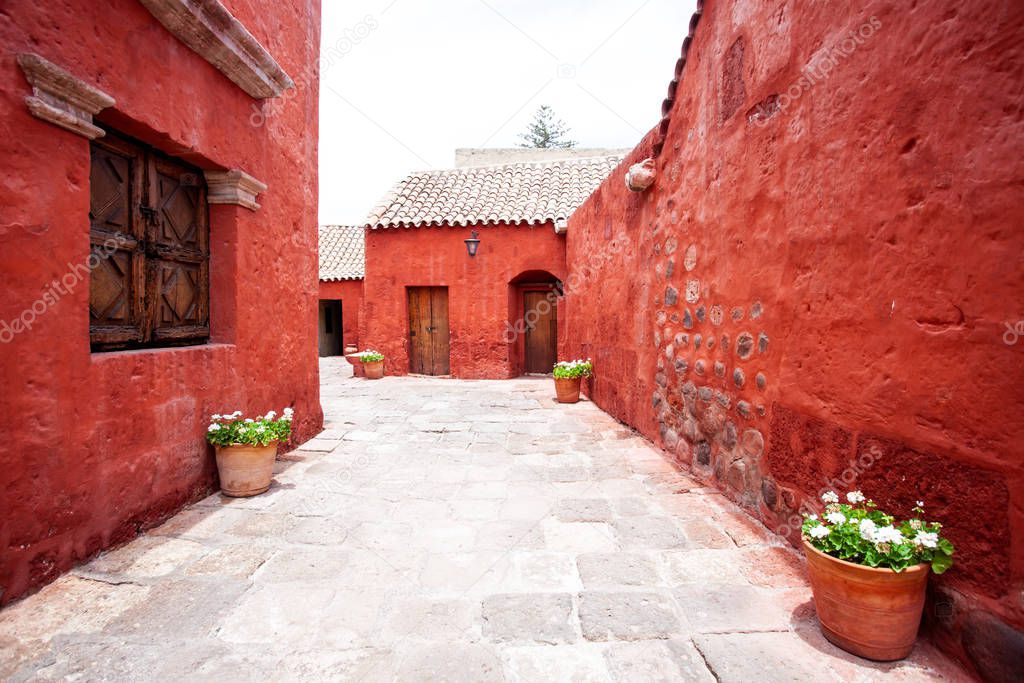 Street with red-walled houses Saint Catalina, Arequipa, Peru