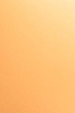 Açık turuncu, şeftali rengi kağıt arkaplan, kopyalama alanı, dikey.