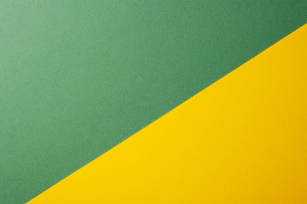 Light green and yellow color of paper background, texture, copy space, diagonal.