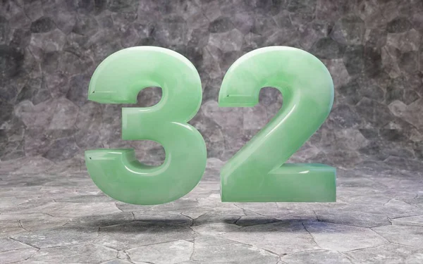 Jade number 32 on rocky backgrond — Stockfoto