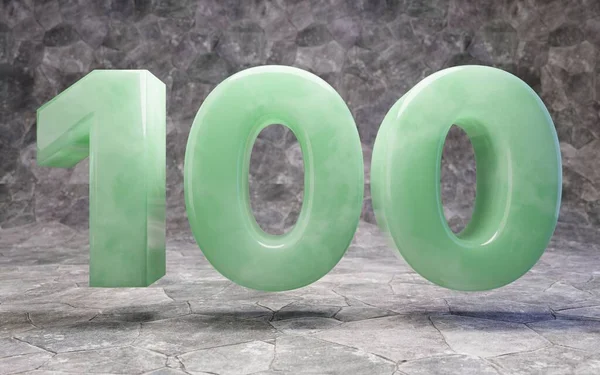 Jade number 100 on rocky backgrond — 图库照片