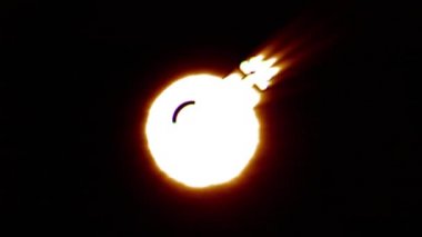 Shiny fire bomb icon fly in center flickers with rgb spectrum colors.