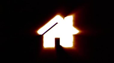 Shiny fire home icon fly in center flickers with rgb spectrum colors.