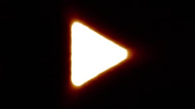 Shiny fire play icon fly in center flickers with rgb spectrum colors.