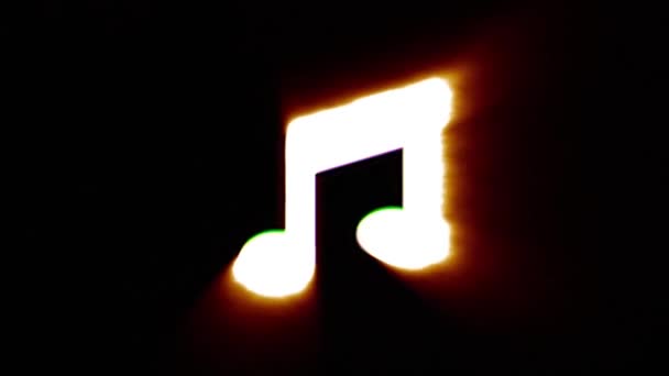 Shiny fire music note icon fly in center flickers with rgb spectrum colors. — Stock Video