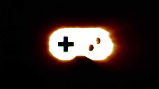 Glänzende Feuer Gamepad Ikone fliegen in der Mitte flackert mit rgb Spektrum Farben. — Stockvideo