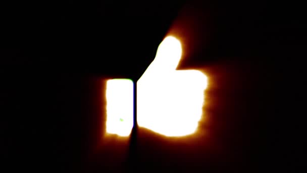 Shiny fire thumb up icon fly in center flickers with rgb spectrum colors. — ストック動画