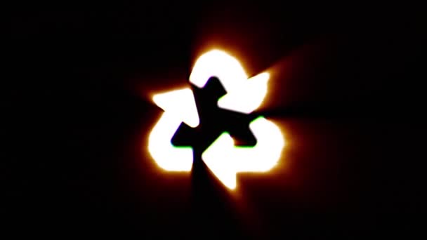 Shiny fire recycle icon fly in center flickers with rgb spectrum colors. — Stock Video