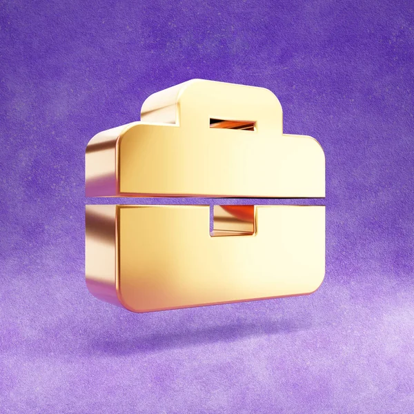 Een klein icoon. Goud glanzend Briefcase symbool geïsoleerd op violette fluwelen achtergrond. — Stockfoto