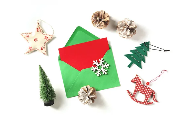 Red Christmas Greeting Card Green Envelope Shot Top White Background — Stock Photo, Image