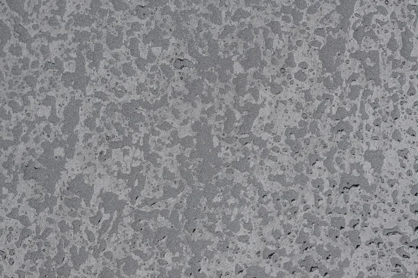 Gotas de água em uma superfície cinza — Fotografia de Stock