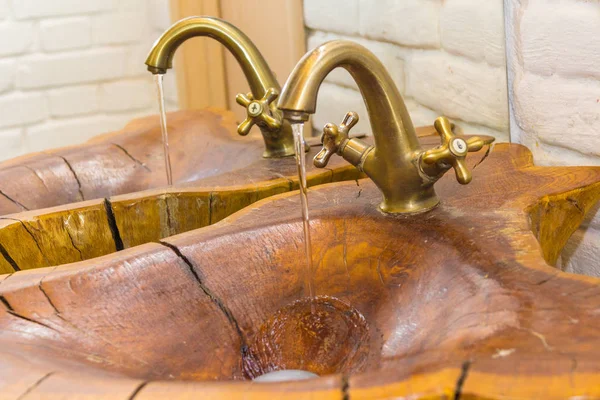 Sink made of wood in the bathroom