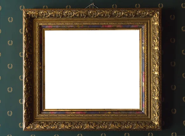 Gilded picture frame on the background of a vintage wall — Stock Photo, Image