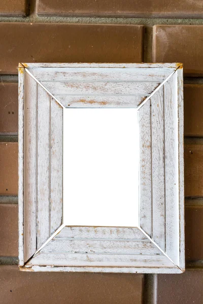 Houten rechthoekige witte frame op een bakstenen muur — Stockfoto