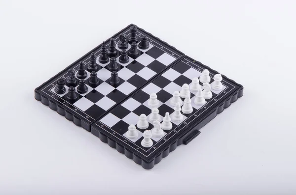 Chess board with figures on white background — Stock Photo, Image