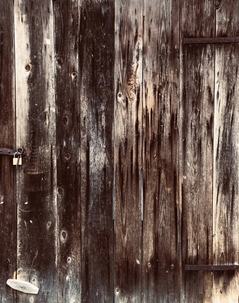 Dark grunge wood door with lock texture background vertical line — Stock Photo, Image